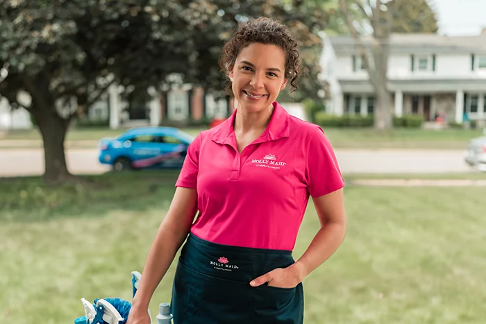 A Molly Maid professional providing home cleaning service