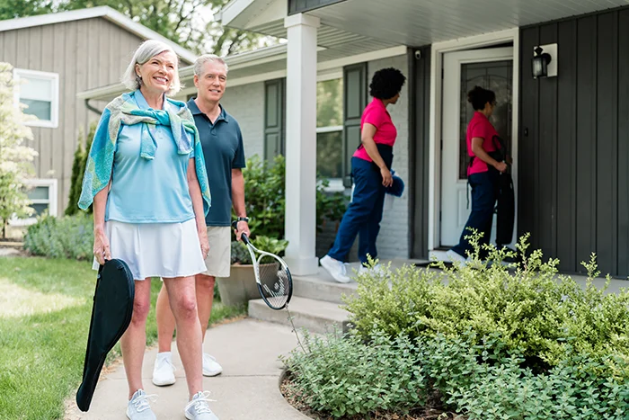 Customers heading out to play tennis as Molly Maid professionals arrive for vacation rental cleaning service.