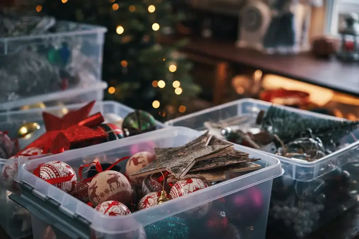 Organize decorations in storage bins to facilitate fast post-holiday cleanup.